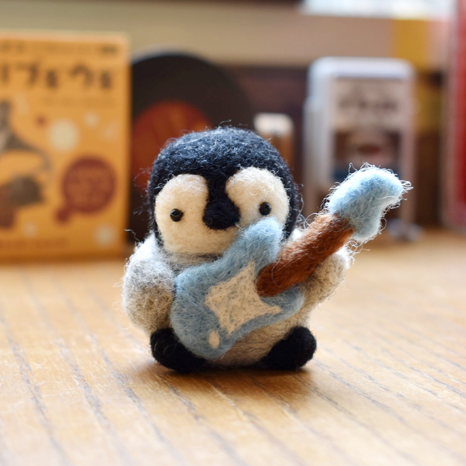 Little Penguin and its Soft Guitar Needle Felted Figure