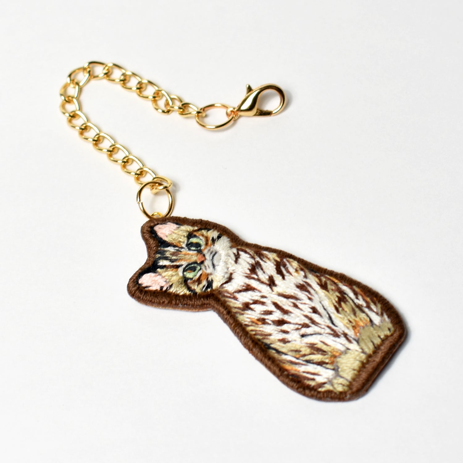 Taiwanese Leopard Cat Tilting Head Embroidered Keycharm