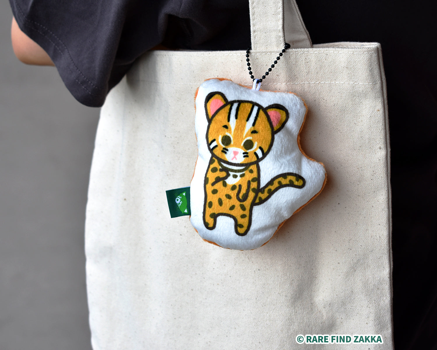 taiwanese leopard cat soft accessory hanging in a bag