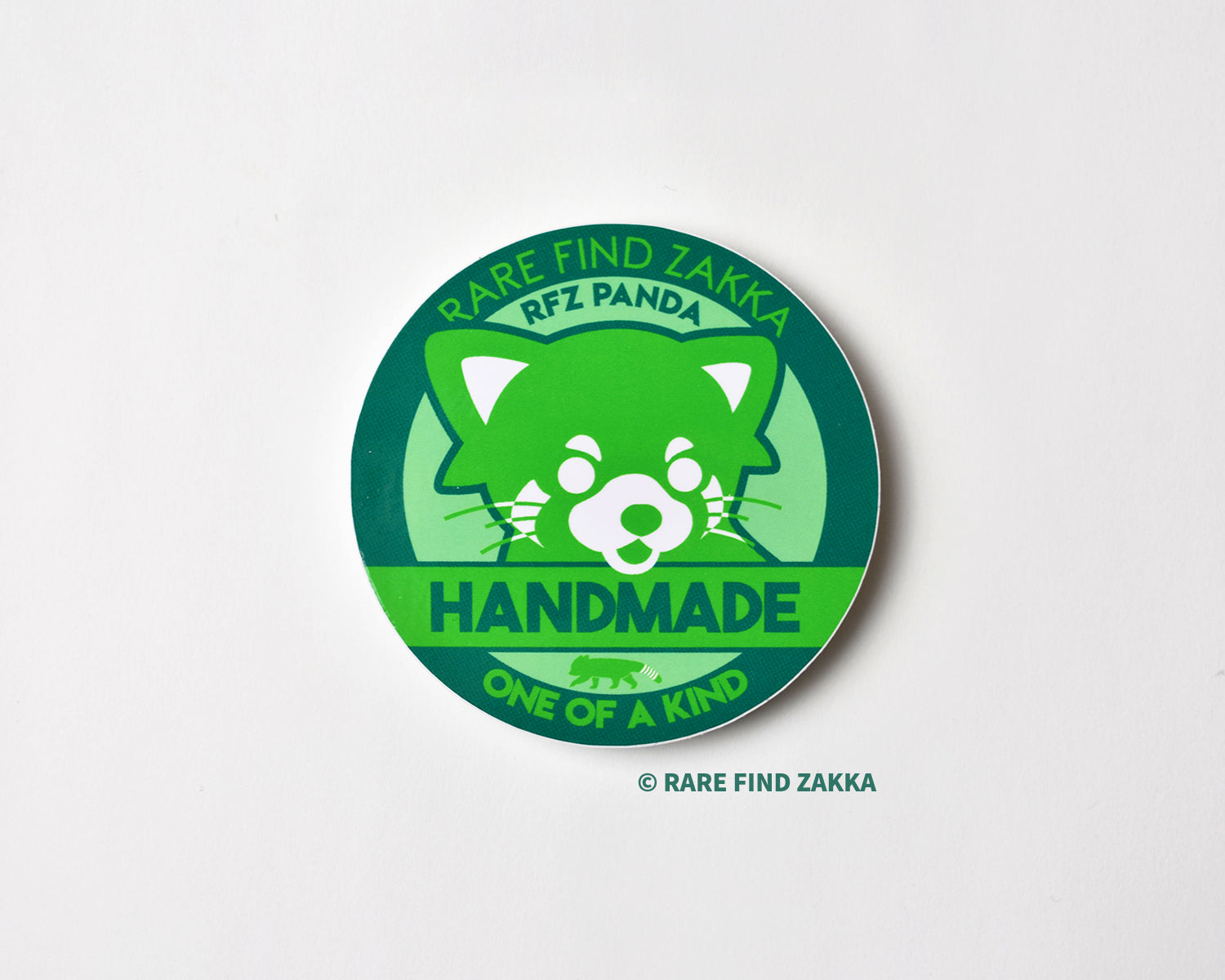 green red panda sticker that says hand made and one of a kind