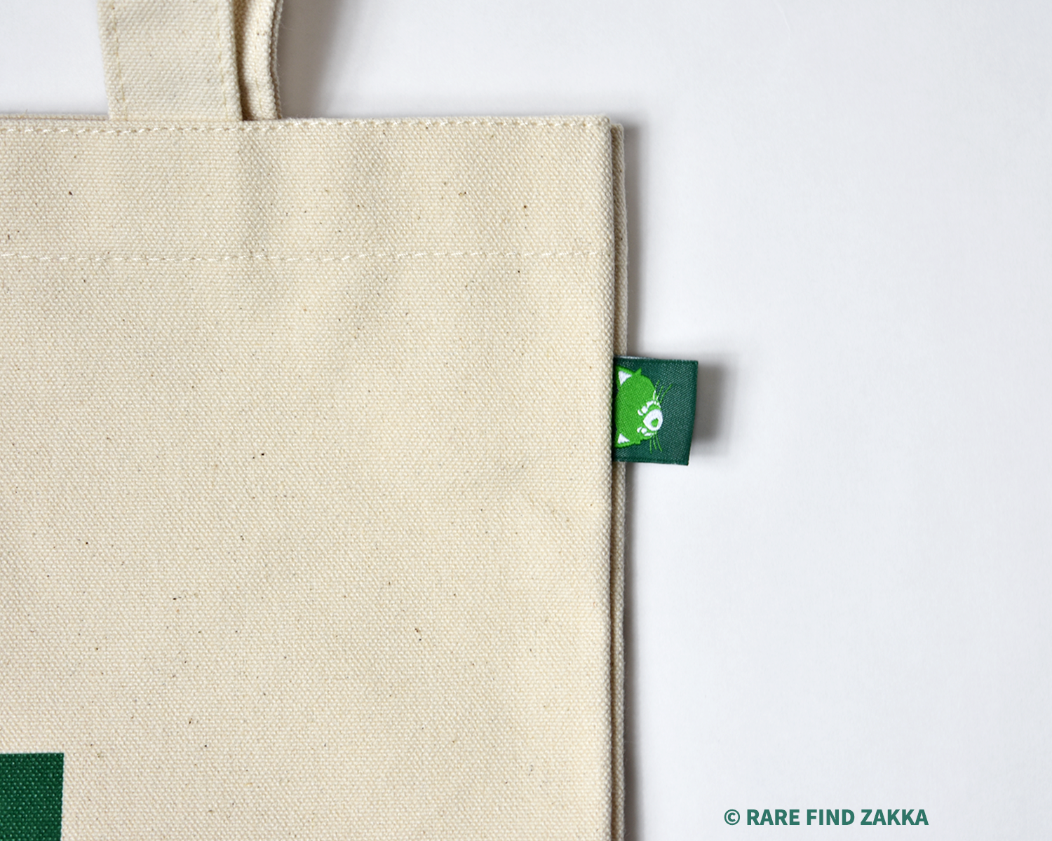 green red panda clothing tag on tote canvas bag