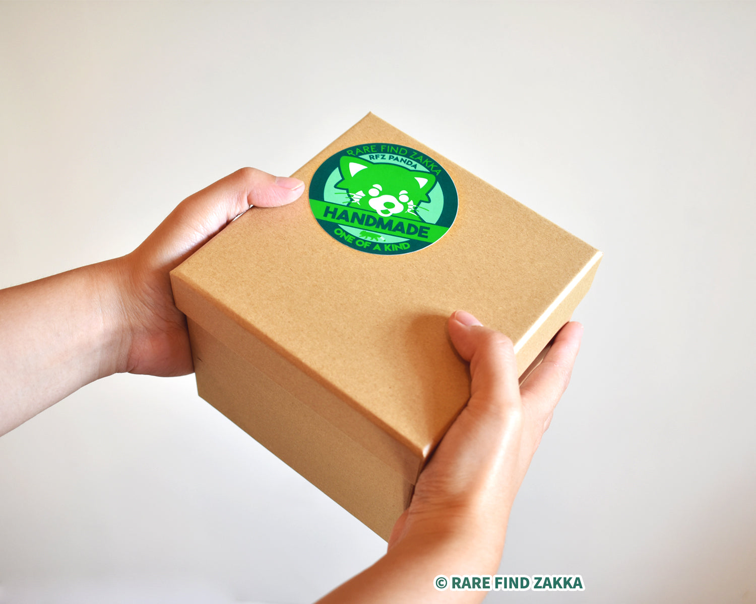 green red panda sticker on a present or gift box